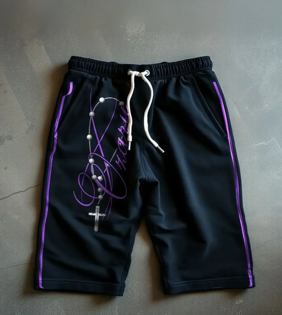 Beyond Limits Rosary Shorts: A rosary wrapped around the OZARU signature. Side stripes.